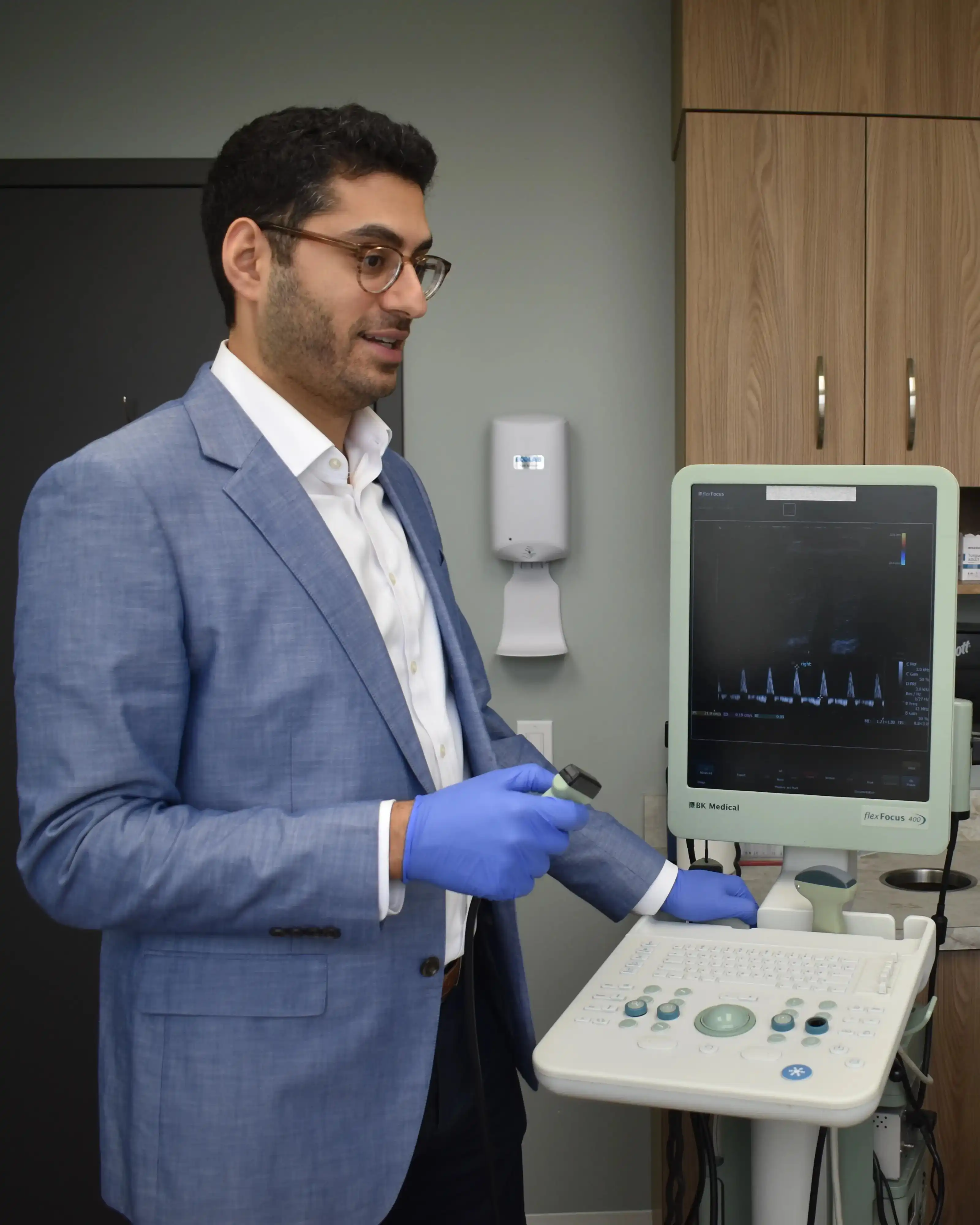 Dr. Mahyar Kashani performing penile Doppler ultrasound consultation at his Long Island urology office
